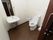 トイレの壁や便器の横に手すりが備わっている。広々としており、大きな鏡のついた手洗い場が完備されている。