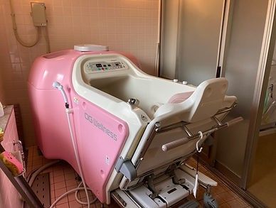 ピンクの入浴補助機器