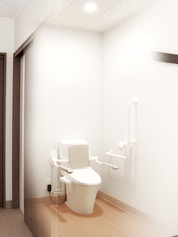 背もたれと手すりが設置されたトイレが居室にあり、自立をサポート。