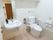 車椅子や介助が必要な場合でもスムーズに使用できる広さがあるトイレである。便座の横には洗面台も完備されている。