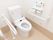 温水洗浄便座機能付きのトイレが設置されていて、両サイドに手すりが取りつけられている。壁にオレンジ色の緊急コールがある。