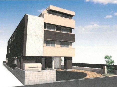 ４階建ての建物は奥行きがあり玄関の前には駐車スペースがある。