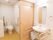 トイレ内は広く、壁の両側に手すりが取りつけられている。扉の外側には洗面台も完備されて、便利に室内で生活できる造りである。