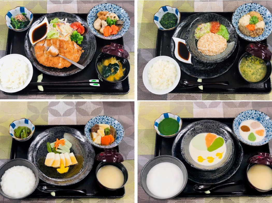 黒いトレーの上に様々な食事形態の食事が並べられている。嚥下状態が下がった人のための食事も彩りよく盛り付けられている。