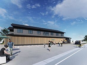 広い駐車場には多くの人が行き来をしていて、和の雰囲気がある２階建ての建物が建っている。