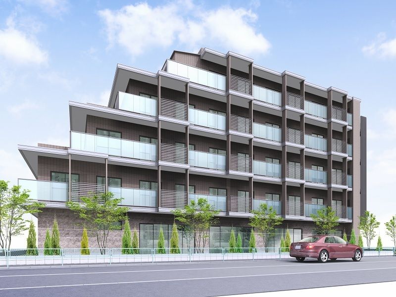 レンガ調の外壁がおしゃれな建物。敷地内にはたくさんの木も植えられ、ナチュラルな雰囲気。
