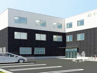 モノトーンの外壁に、エクラシア玉川学園と書かれている3階建て建築物