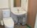 トイレと手洗い場が同じスペースにあり、トイレは温水便座、手洗い場には鏡が付き、車いす対応のデザイン。