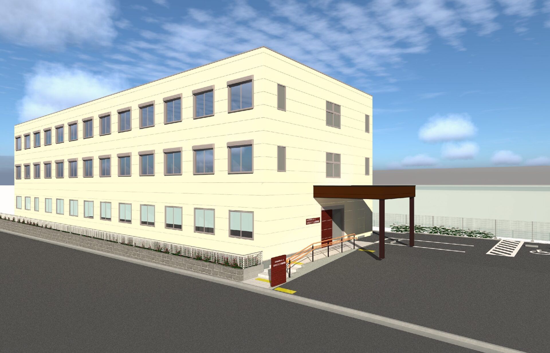 ３階建ての建物は白系で駐車場もある。玄関部分には屋根が付き、建物のすぐそばに道路がある。