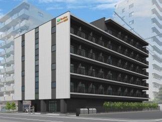 モノトーンの6階建ての建物は現代風のスタイリッシュなデザイン。ぱっと見施設には見えず、周りのビルが建ち並ぶ風景になじんでいる。