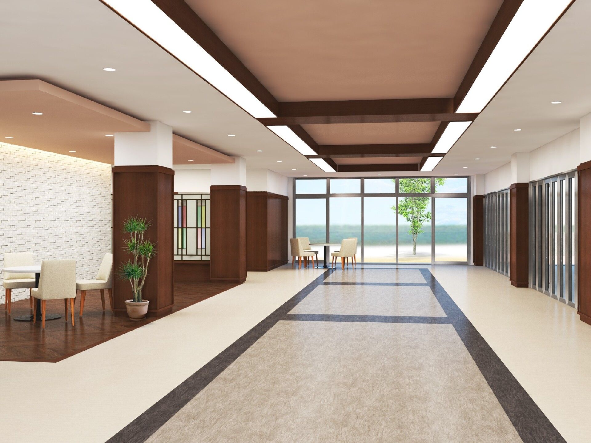 大きな窓が付き、日差しがたっぷりと入ってくる設計。窓のそばや通路のサイドにはテーブルセットが置かれ、観葉植物なども飾られている。