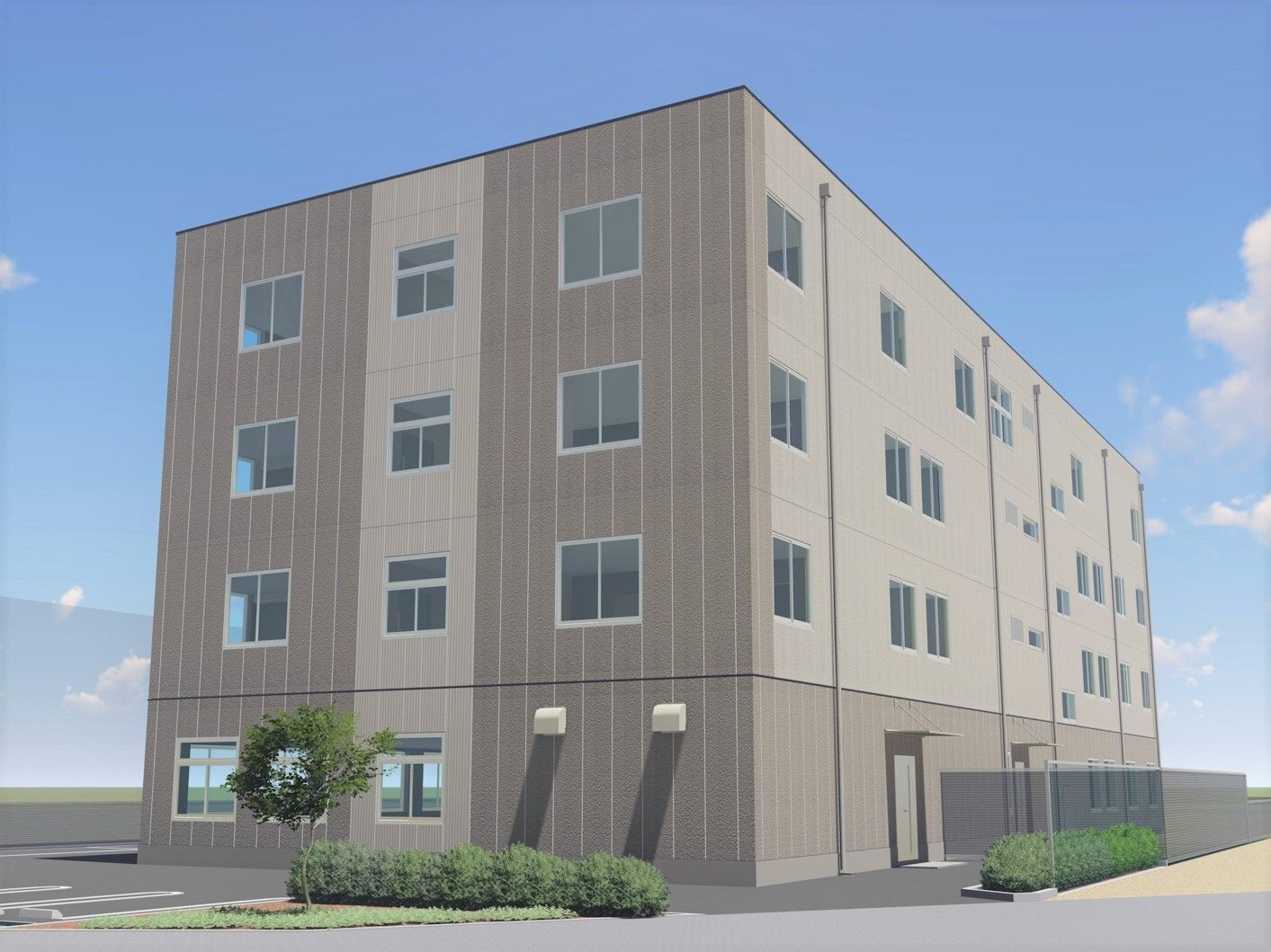 グレーでまとめられた4階建ての建物を側面から見た様子。敷地内には緑が植えられ、駐車スペースもある。青空が広がり、日当たりもよい。