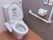 洋式のトイレがあり、便座の隣にウォシュレットの操作パネルがついている。左右の壁に手すりがついていて、緊急時のブザーが壁についている。