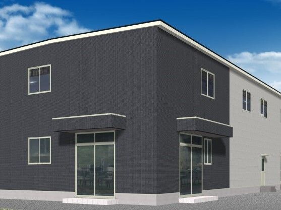 2階建ての建物には屋根がなく、四角いデザイン。モノトーンでスタイリッシュな外観。