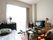部屋にはテレビが置かれている。さらにはタンスも置かれていて、収納に便利である。また、テーブルや椅子も置かれている。