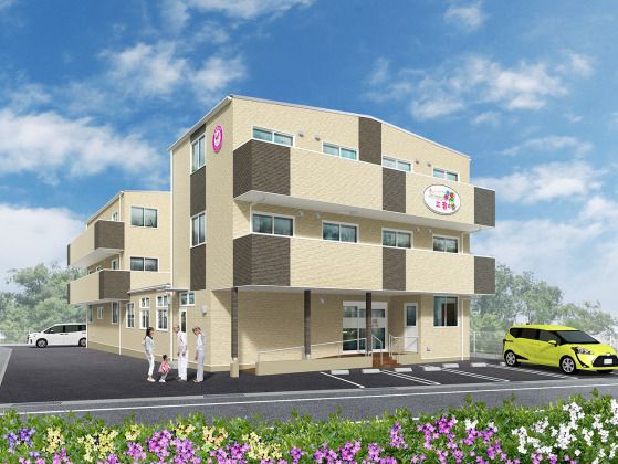 敷地内には駐車場があり、明るい雰囲気の住まい。ベージュ系の３階建ての建物で各フロアにベランダが付いている。
