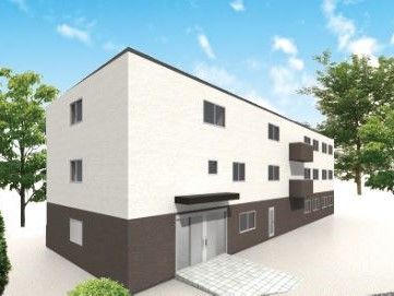 1階が茶色、2階と3階が白い外壁の3階建て建築物