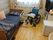 部屋にベッドと車いすと生活用品