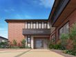 緑に囲まれた建物の外観
