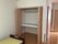 収納スペースとベッドの部屋