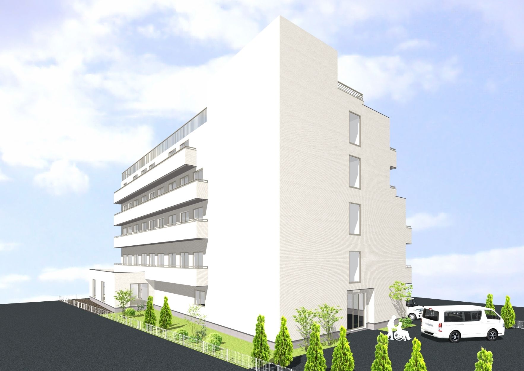 白い建物と駐車場の外観