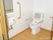 しっかりとした背もたれや手すりが設置されており、利用しやすいトイレである。窓があるので明るく、清潔感がある。
